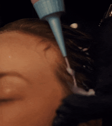 woman-getting-blonding-service-at-salon